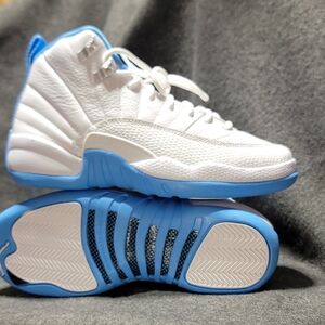 Air Jordan 12 Retro "Melo" in white and university blue. 4.5Y
